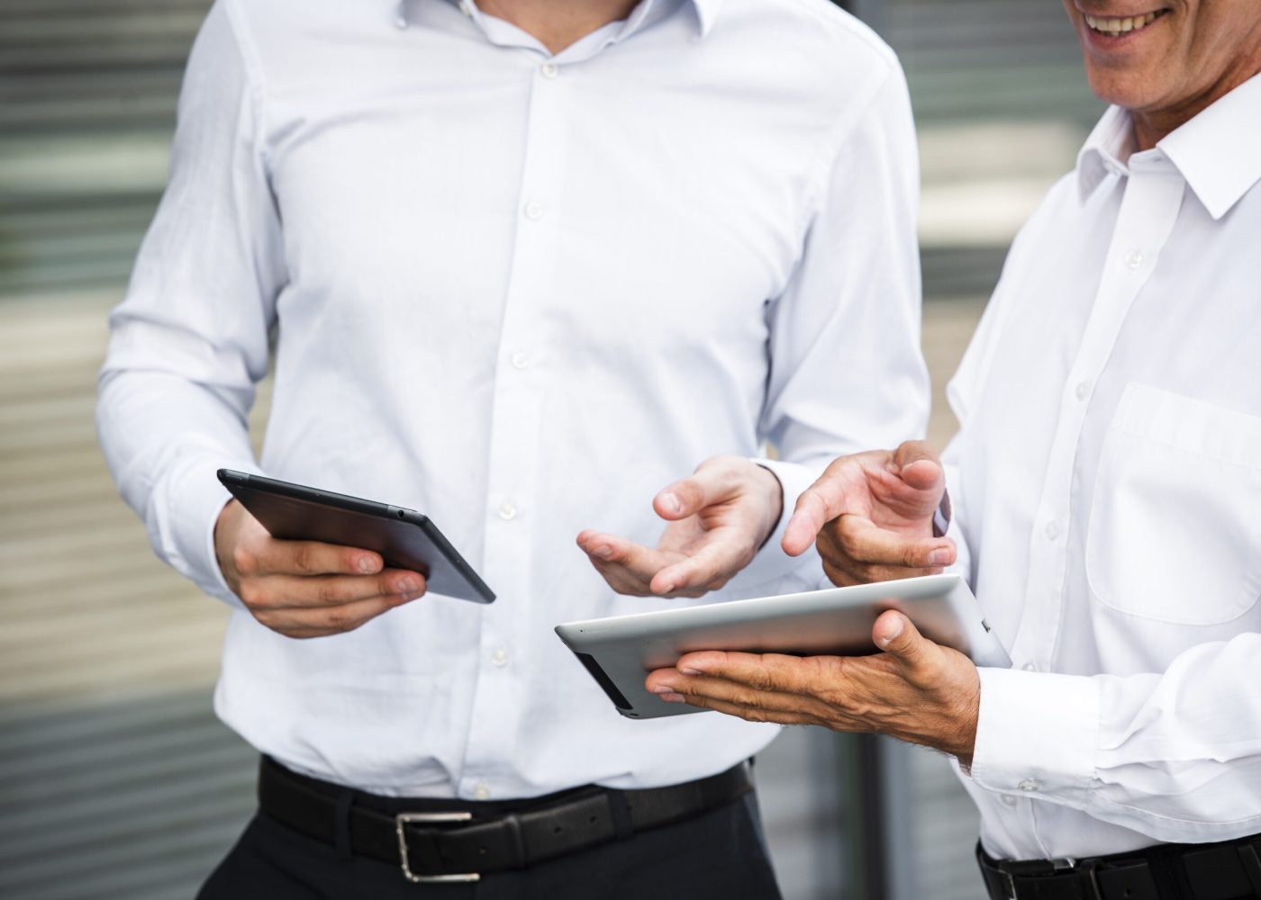 businessmen-looking-tablets