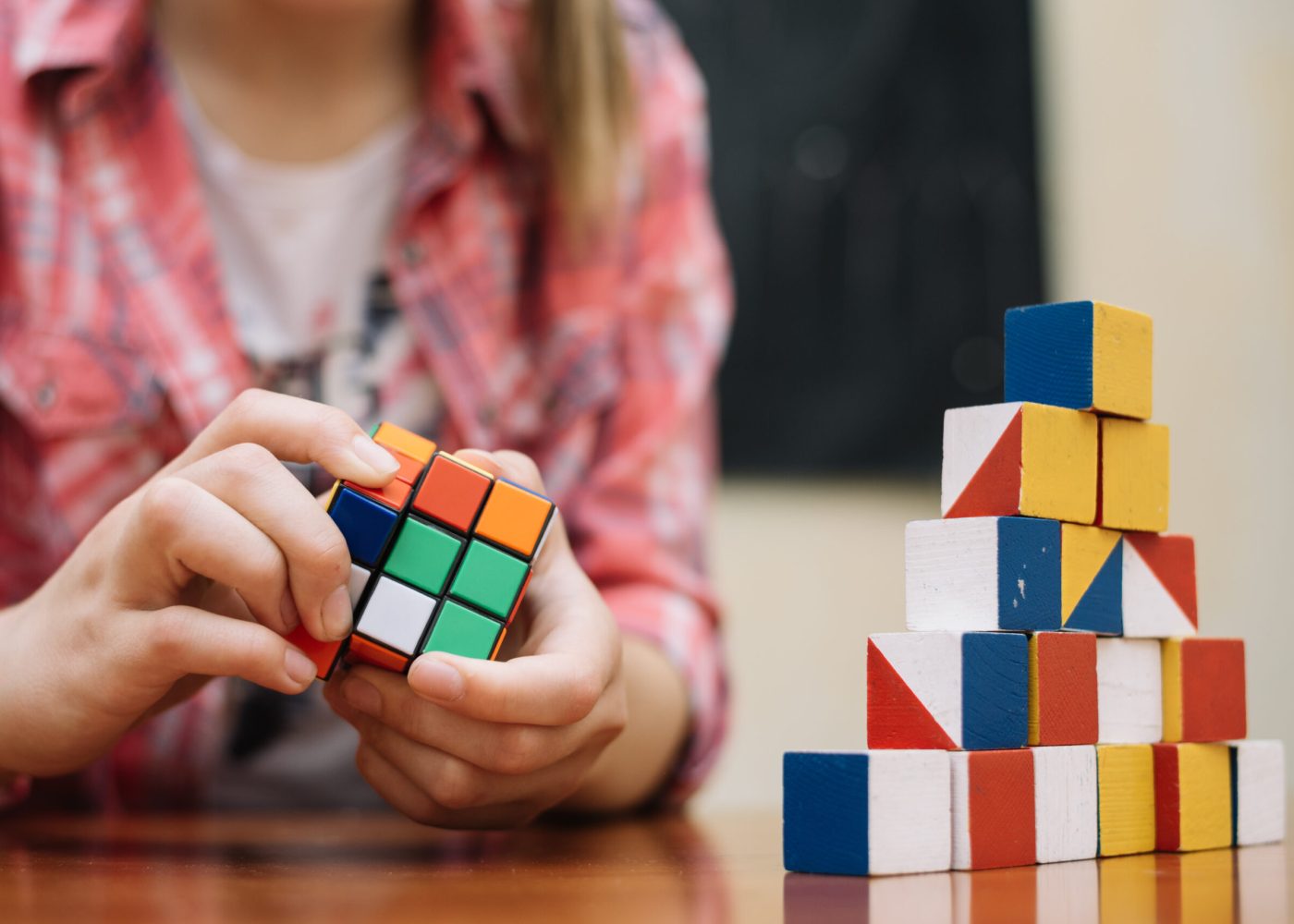 girl-playing-with-cube-puzzle