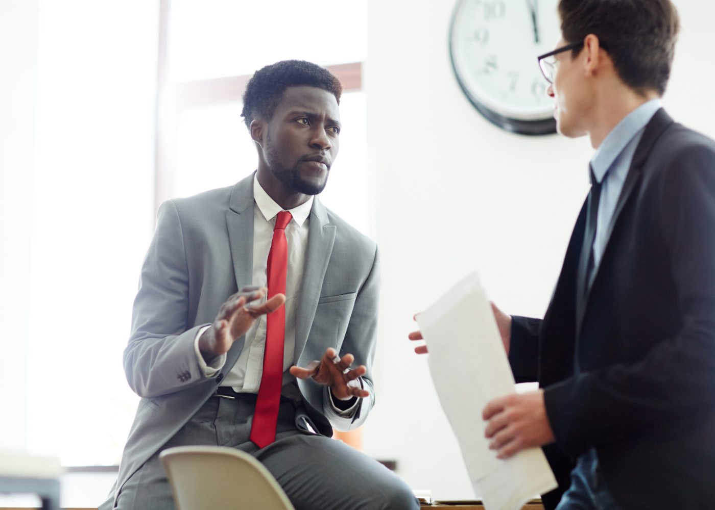 Confident business partners having talk at meeting