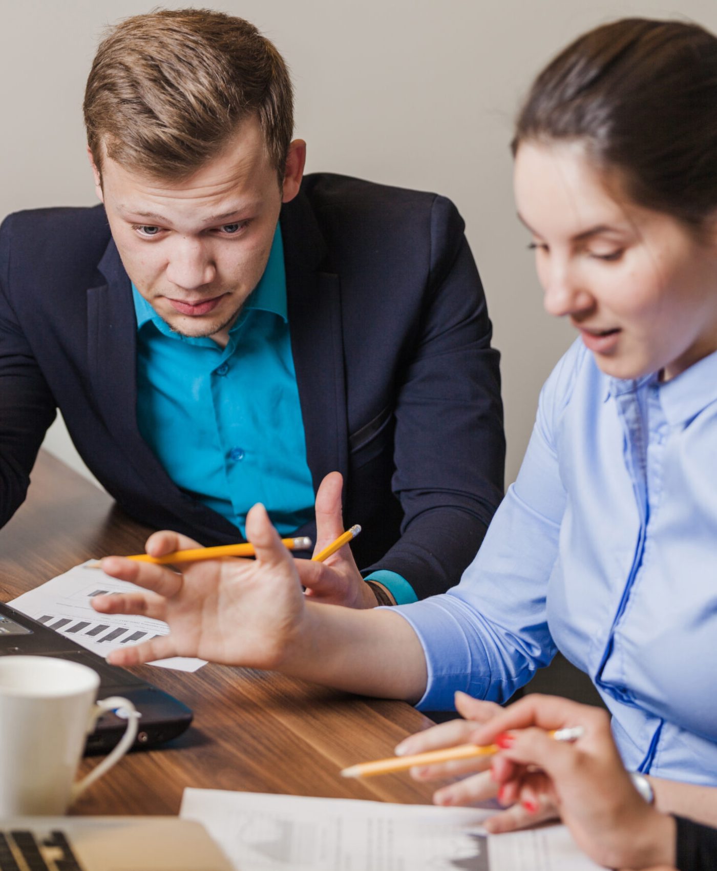 office-employees-sitting-desk-talking
