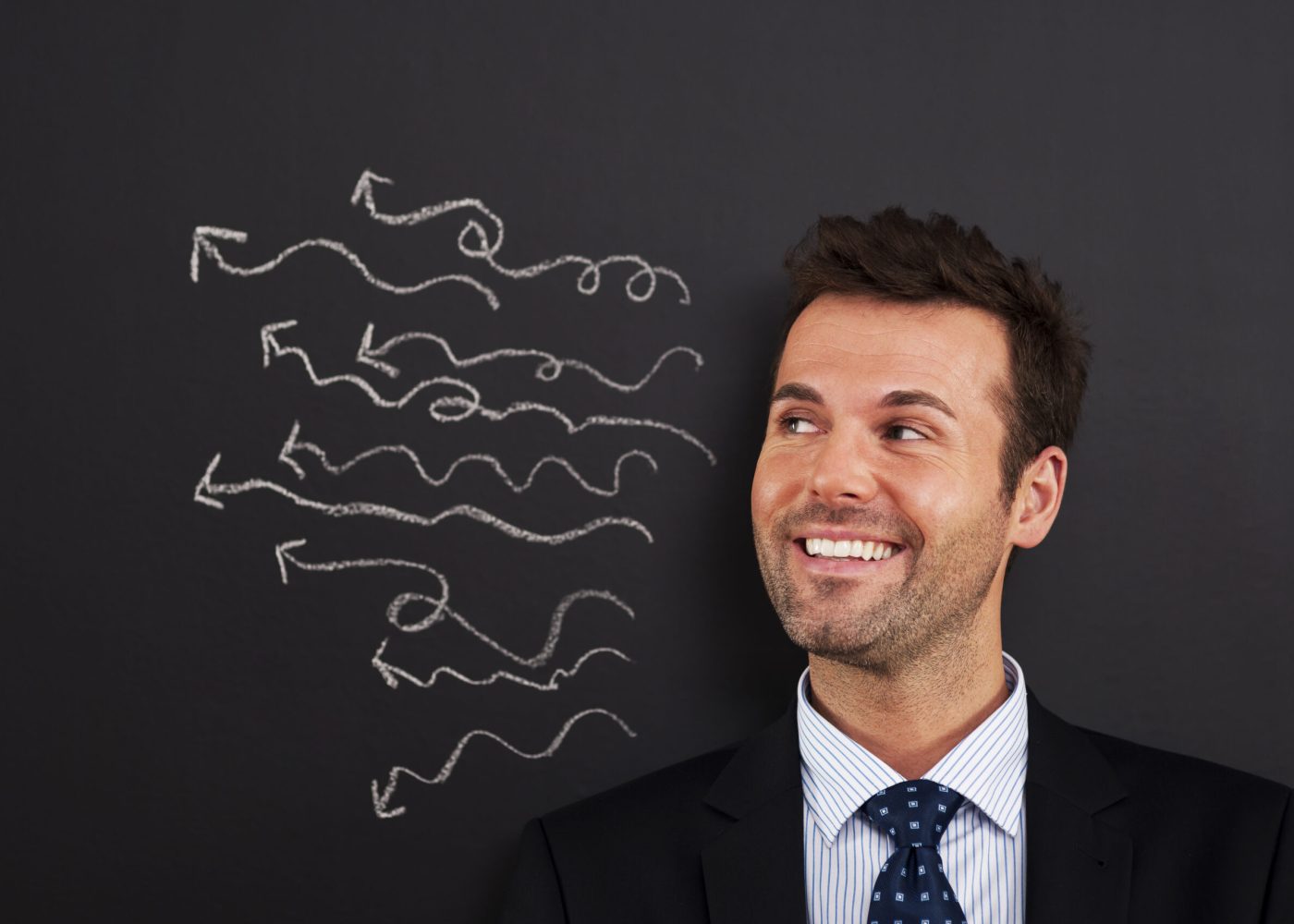 Smiling businessman have a lot of crazy ideas